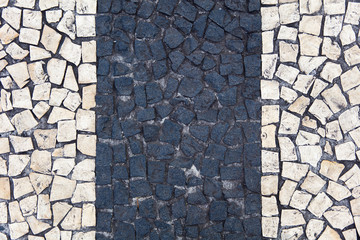 Closeup surface of blocky pattern old stone pavement