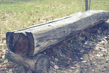 a bench of logs