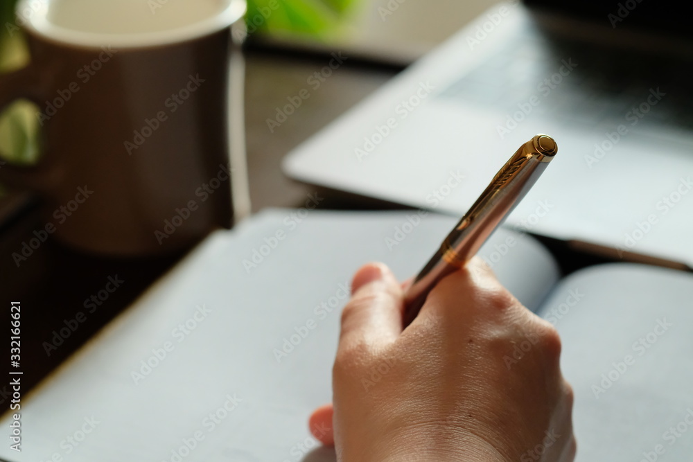 Wall mural デスクワーク。Wood office desk table with laptop, coffee and supplies.