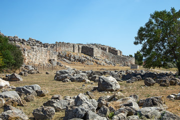 Fototapeta na wymiar Ruins of ancient acropolis of Tiryns - a Mycenaean archaeological site in Argolis in the Peloponnese, and the location from which mythical hero Heracles performed his 12 labors, Greece.