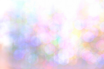 Colorful rainbow shade indoor light bokeh defocused texture. Confetti abstract texture. Christmas flicker decor.Iridescent glitter empty background. Festive background bokeh and bright lights.