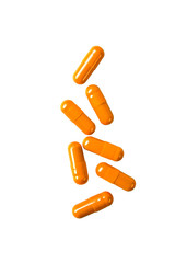 Orange pill capsules isolated on white background