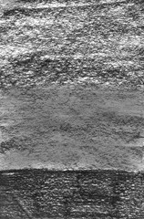 Texture of paper with prints of charcoal.