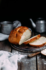 Wheat flour bread on the table. Sandwich with butter