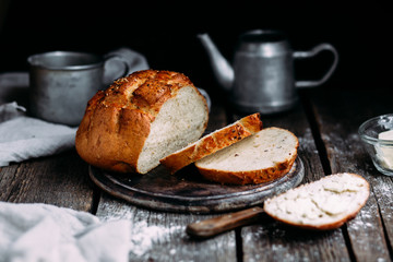 Wheat flour bread on the table. Sandwich with butter