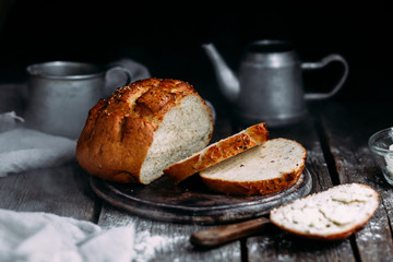 Wheat flour bread on the table. Sandwich with butter