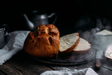 Wheat flour bread on the table. Sandwich with butter
