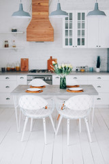 Slow living lifestyle concept. Kitchen interior and table setting.