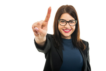 Portrait of young business girl wearing glasses using touchscreen