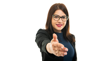 Selective focus of business girl wearing glasses offering hand shake