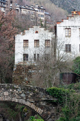 Old European city and stone bridge in the mountains