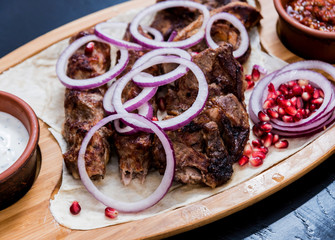 Georgian cuisine food. Grilled meat with khinkali. Georgian restaurant.