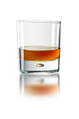 Glass with whiskey on the white background