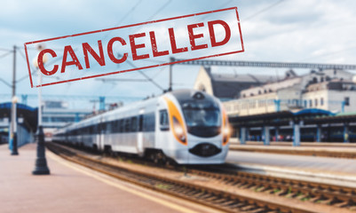 Trains cancelled due to pandemic of coronavirus. Passenger railway travel and transportation cancellation due to epidemic of Covid-19.  Background with railway station, high speed train and text