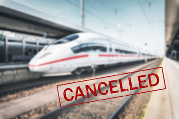 Trains cancelled due to pandemic of coronavirus. Passenger railway travel and transportation cancellation due to epidemic of Covid-19. Background with railway station, high speed train and text