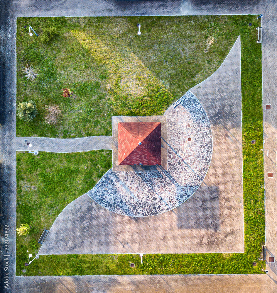 Wall mural aerial view from drone a little outdoor park between buildings