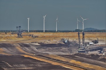 lignite opencast mining in Germany with windmills in the background