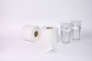 Toilet paper rolls with two glasses of water