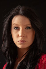Fototapeta premium Low key portait of a pretty young woman