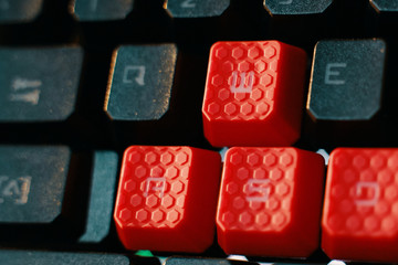 Gaming Keyboard. Computer laptop keyboard with red button.