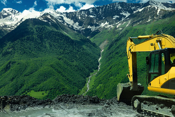 excavator in the mountains