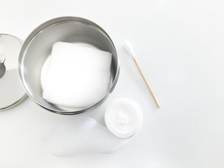 gauze jar and gauze inside with swab and roll gauze with copy space