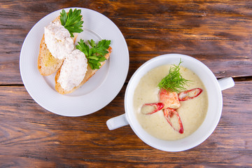 Puree soup with crab meat and greens