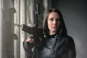 Concept of special agent girl with airsoft rifle.
