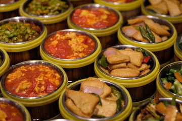 close up various kinds of Chinese food. twice-cooked pork. Scramble egg with tomato. blur background