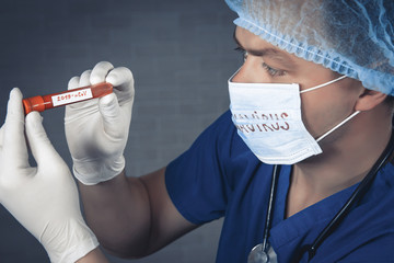Doctor wearing respirator mask holding a positive blood test result for the new rapidly spreading...