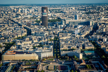 Aerial cityscape of Paris taken from the top of the Eiffel Tower at a sunny afternoon