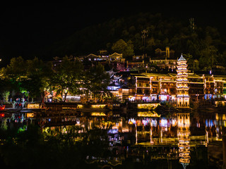 Fototapeta premium fenghuang,Hunan/China-16 October 2018:Scenery view in the night of fenghuang old town .phoenix ancient town or Fenghuang County is a county of Hunan Province, China