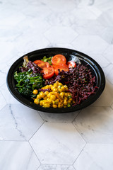 Turmeric Chickpea Salad with Black Rice, Kale, Cherry Tomatoes, Kale and Forbidden Rice.
