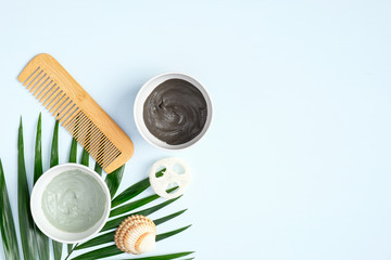 Natural organic SPA cosmetic products for hair. Homemade hair mask in bowls and hair comb. Top view, flat lay