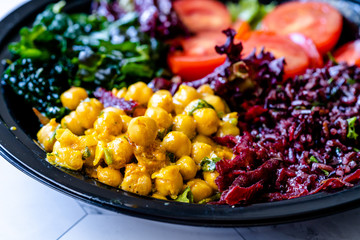 Turmeric Chickpea Salad with Black Rice, Kale, Cherry Tomatoes, Kale and Forbidden Rice.
