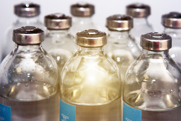 Vials of medicinal solution for the treatment of patients (Coronavirus vaccine, research, success - concept)