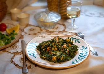 Homemade mashed salmon in pesto sauce, served with glass of white wine