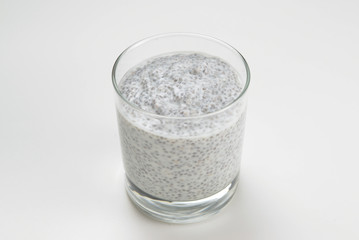 Chia pudding  in glass on a white background. Space for text or design.