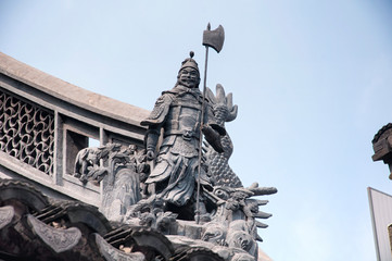 A chinese warrior atop the shanghai city god temple