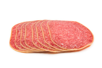 Salami slices isolated on white background.