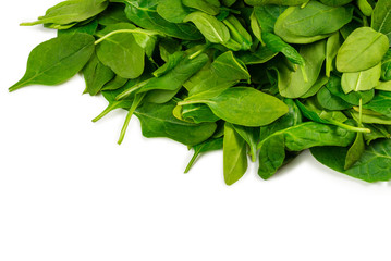 Fresh spinach leaves as background.