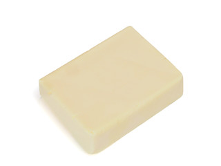 piece of butter isolated on white background, top view