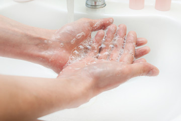Washing hands with soap and water. Antibacterial protection and self-care. Stop the spread of infection.
