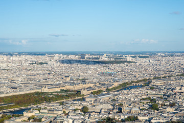 Aerial cityscape of Paris taken from the top of the Eiffel Tower at a sunny afternoon