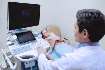 Fototapeta na wymiar Ultrasound examination of the legs in medical clinic.