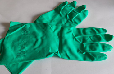 Green rubber gloves. Hand protection equipment