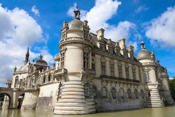 Fototapeta na wymiar External view of famous Chantilly Castle, 1560 - a historic castle located in town of Chantilly, Oise, Picardie .
