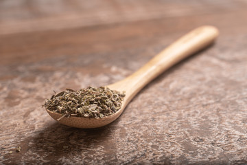 Dried Oregano into a Teaspoon.