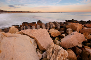 Fototapeta na wymiar Narragansett Towers Beach at Sunset, Narragansett RI, USA. The Beach is a classic New England Saltwater Coastal Beach front that offers some of the best, cleanest and accessible beach conditions.