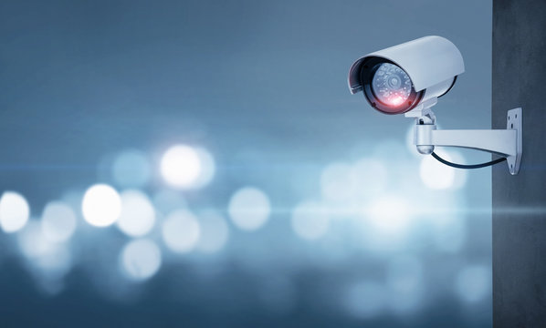 Close up of CCTV camera over defocused background with copy space